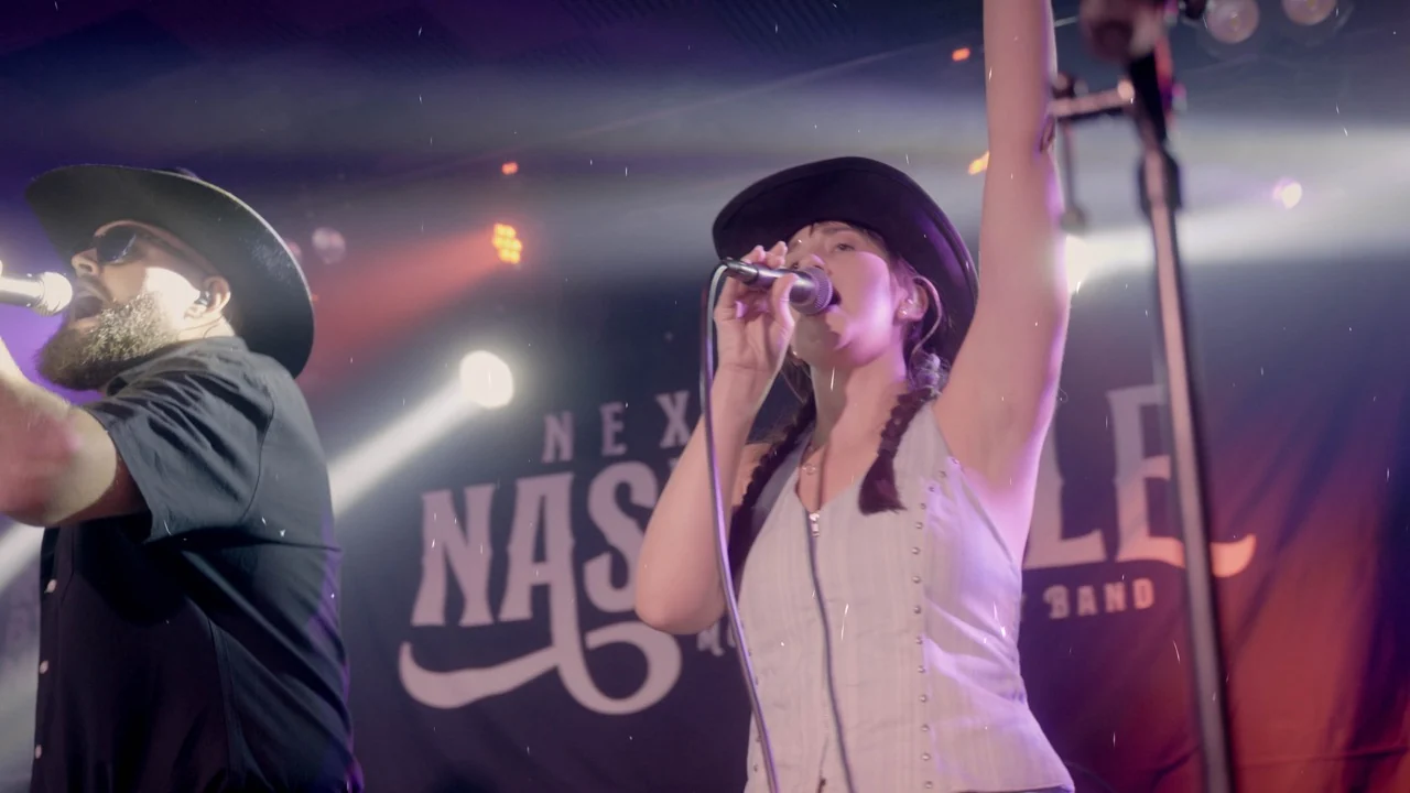 Next Stop Nashville male and female vocalists singing together